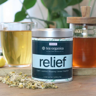 Tea Organica 'Relief' tea canister with a glass of tea and jar in the background #satchets